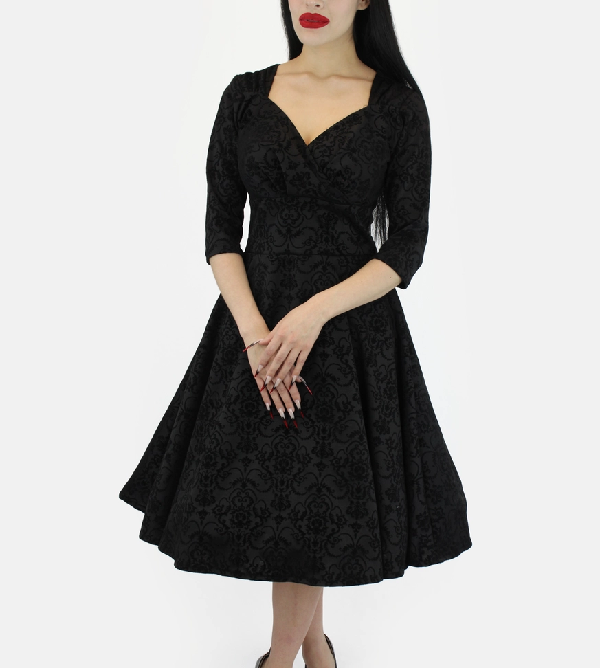 Black dress with sleeves and surplice V-neckline