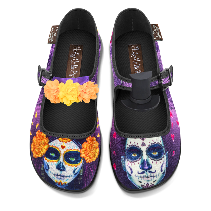 Hot Chocolate Design Dia de Muertos mary janes with vibrant Day of the Dead artwork and themed accessories.
