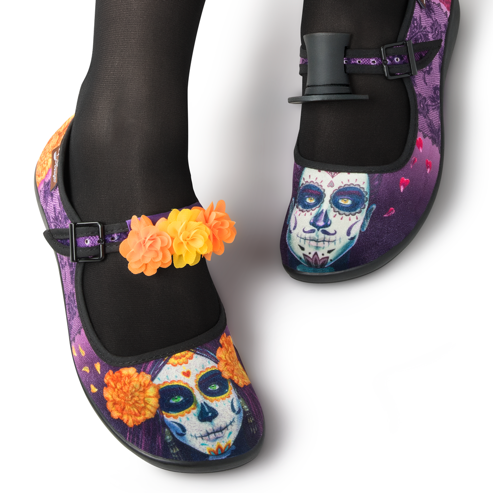 Hot Chocolate Design Dia de Muertos shoes featuring colorful Day of the Dead artwork and themed accessories.