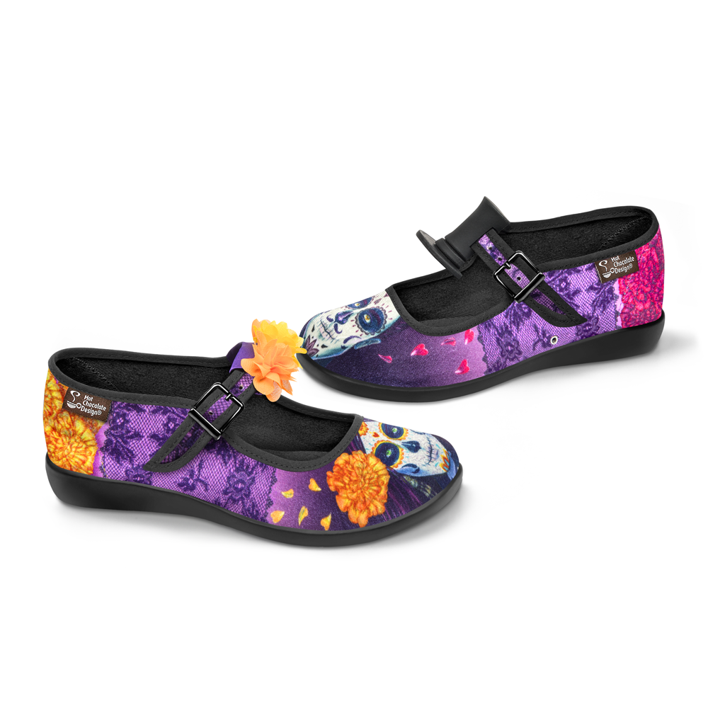 Hot Chocolate Design Dia de Muertos mary janes featuring vibrant Day of the Dead artwork and floral accessories.