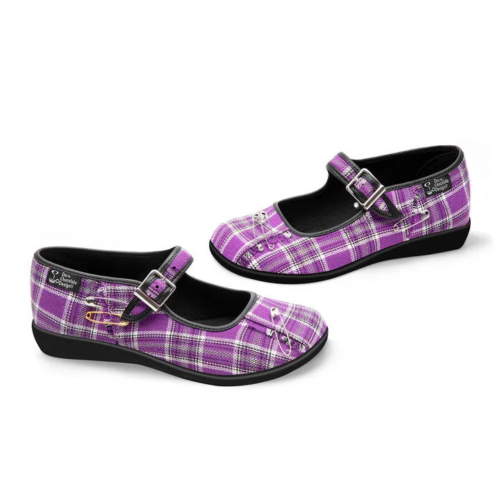 Purple plaid shoes with buckles on a white background