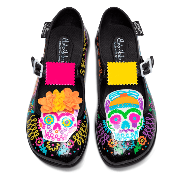 Hot Chocolate Design - Sugar Skull shoes featuring vibrant designs and floral accents on a black background.