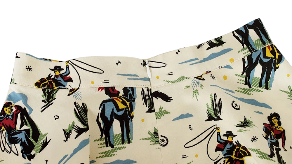 Cowboy-themed skirt with horse and rider design on a white background