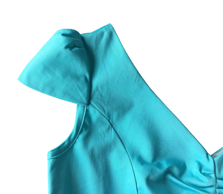 Close-up of the cap sleeve on the Maisie Blue Pencil Dress, showcasing its vintage-inspired design and vibrant color.