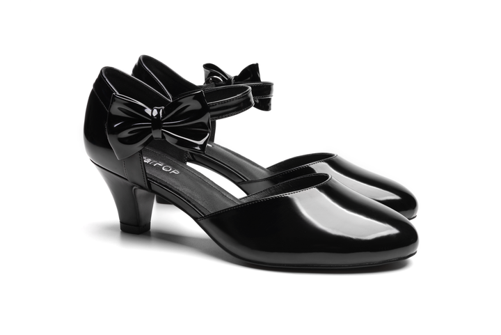 Stylish black SugarPOP DragonGlass v2 shoes with a bow design and a sleek heel.