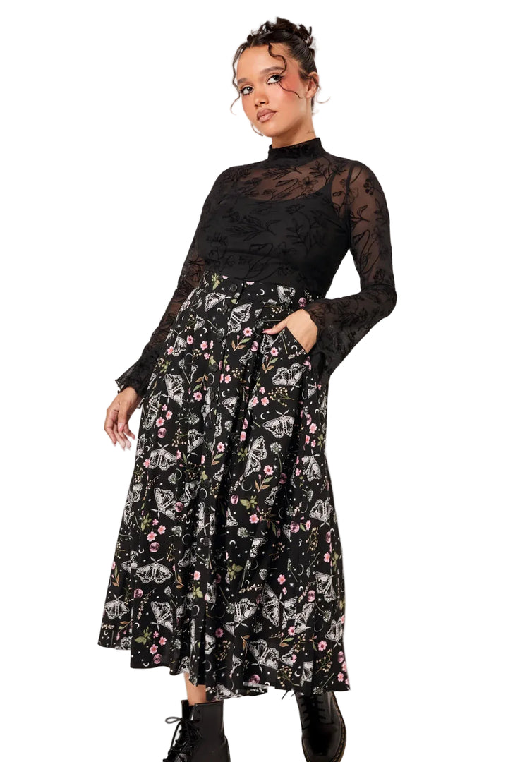 Model wearing Hell Bunny Chrysalis black moth print midi skirt with boots and black mesh top