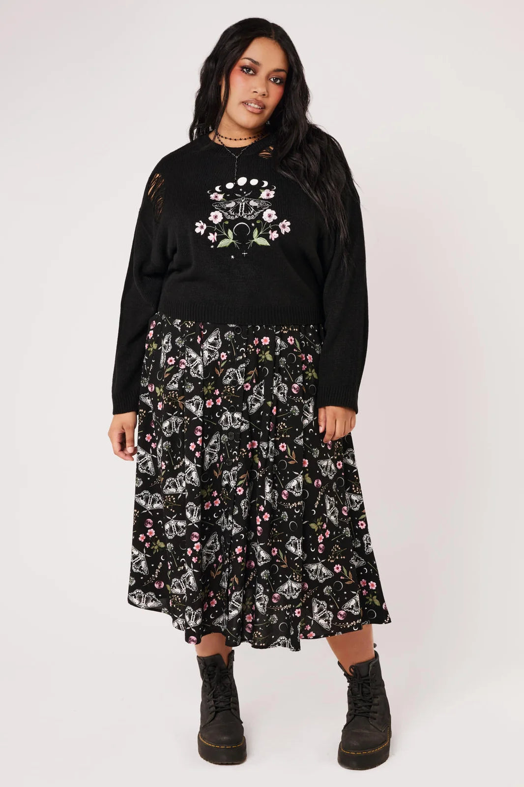 Plus size model wearing Hell Bunny Chrysalis black celestial moth print midi skirt