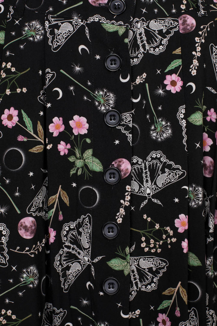 Close up of Hell Bunny Chrysalis Skirt moth moon floral print and black button front