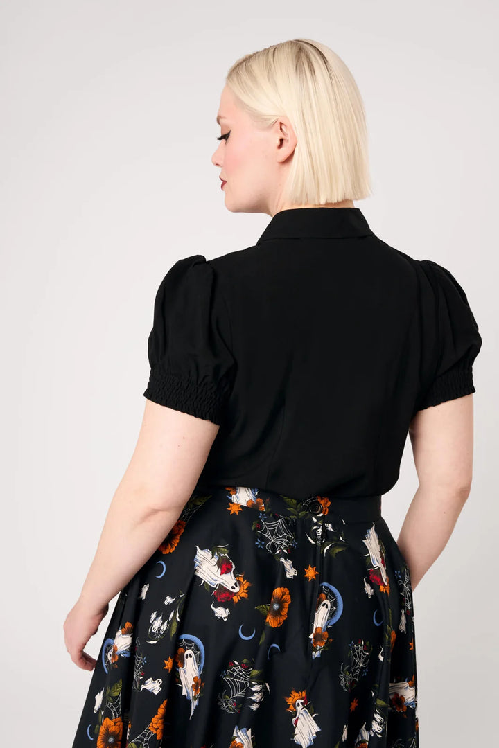 Back view of Hell Bunny Ghost Flower black blouse with short puff sleeves
