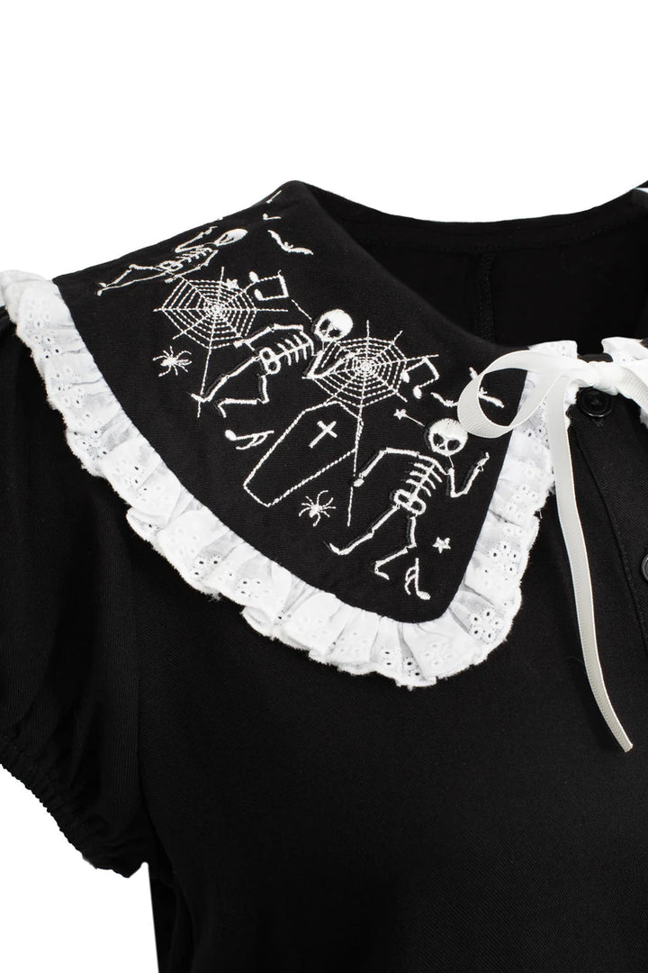 Close up of Hell Bunny Danse Macabre blouse collar with skeleton coffin and spiderweb embroidery