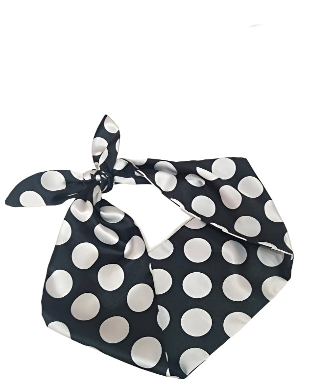 Rockabilly hair tie featuring large black and white polka dot print on satin fabric, perfect for vintage-inspired hairstyles.
