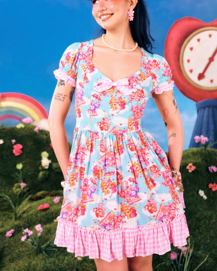 Hell Bunny x Care Bears™ Picnic Bear blue mini dress with pink gingham frills, puff sleeves and printed flared skirt