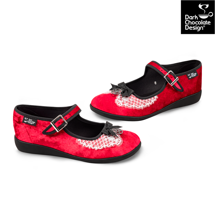 Red and black shoes with fishnet details and buckles on a white background, featuring Dark Chocolate Design logo.