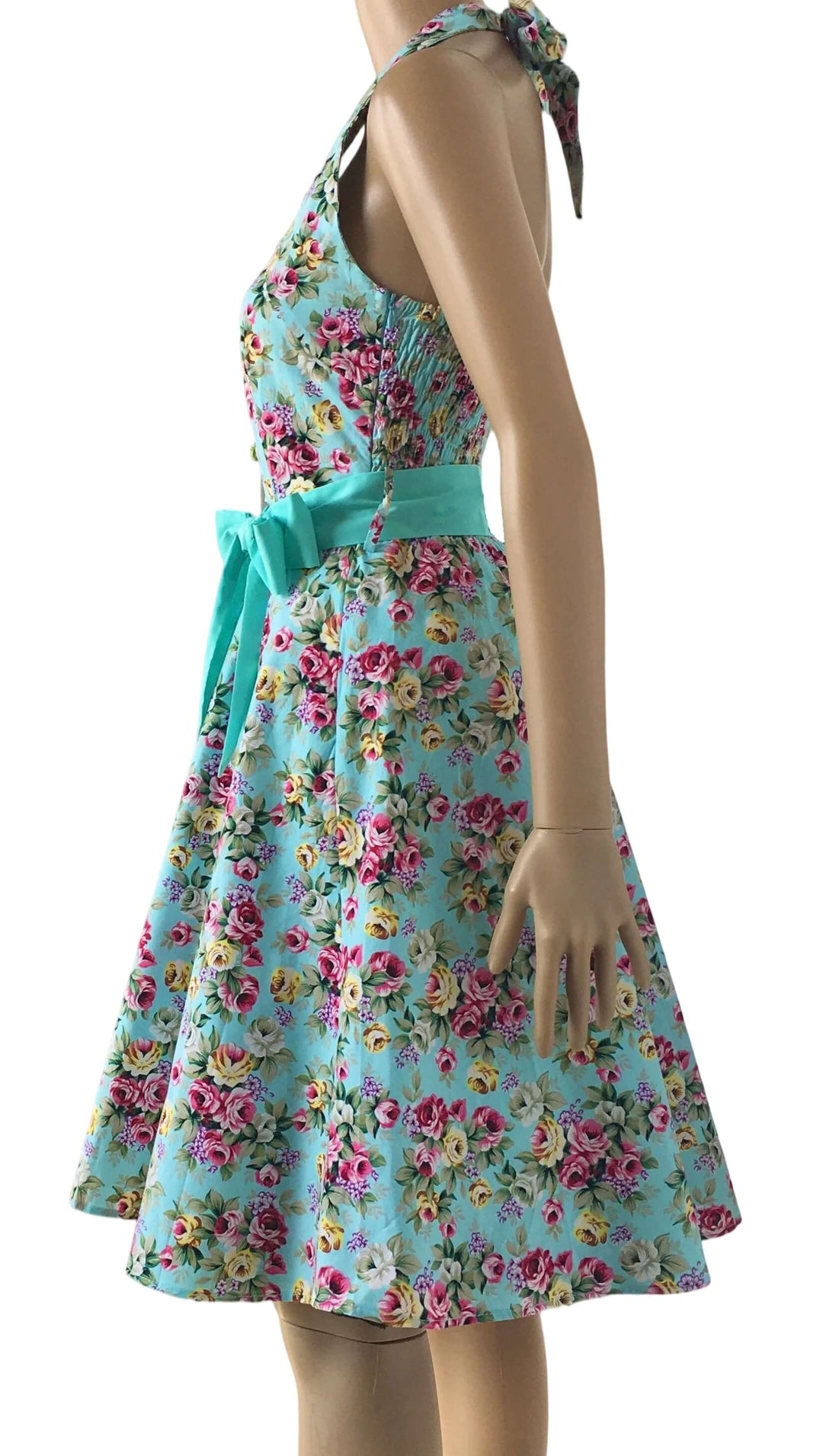Aqua Floral Rockabilly Swing Dresses featuring a floral halter neckline and cinched waist for a flattering 1950s-inspired look.