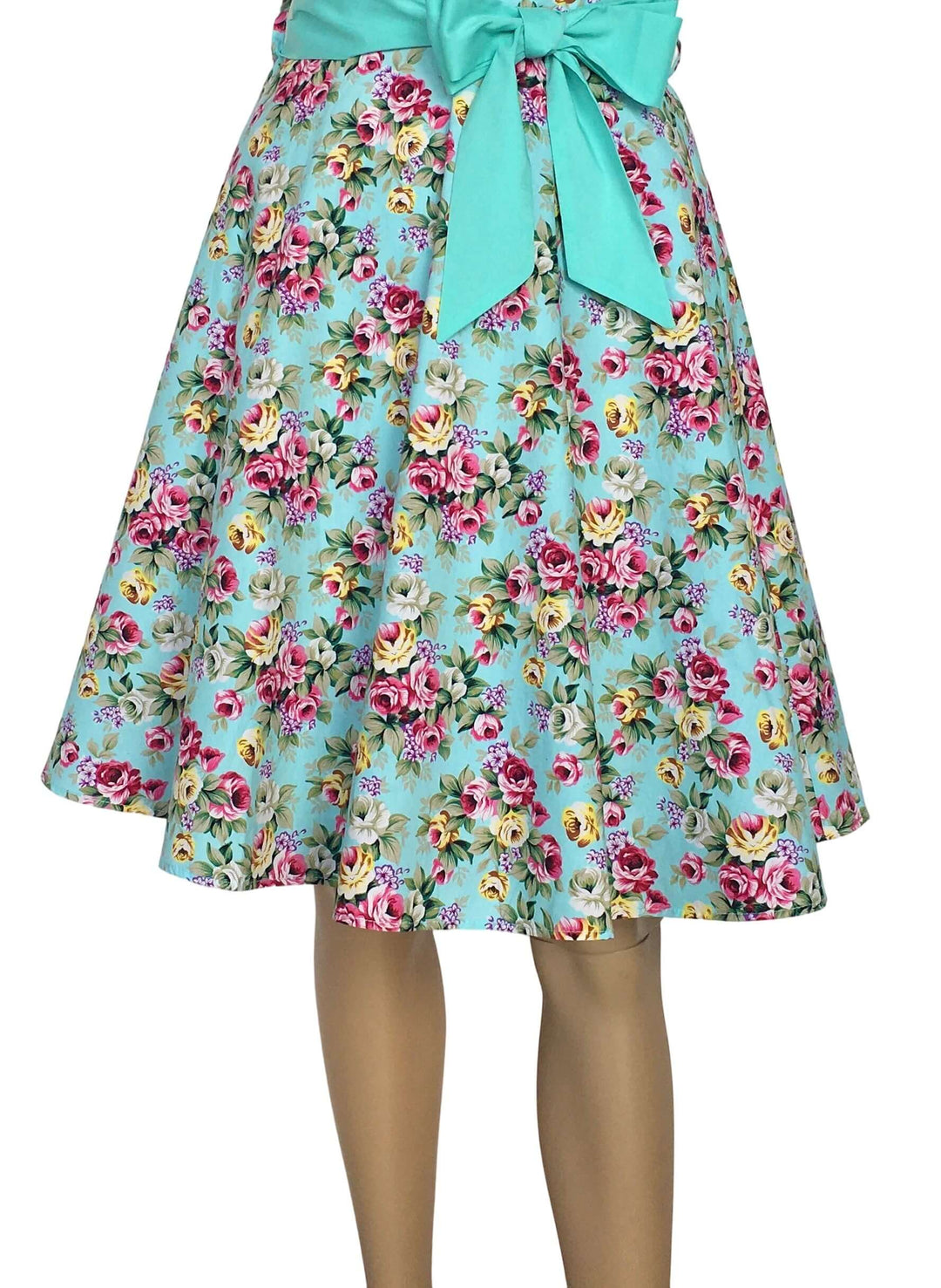 Aqua Floral Rockabilly Swing Dresses showcasing a vibrant floral pattern and bow detail on a 1950s-style swing skirt.