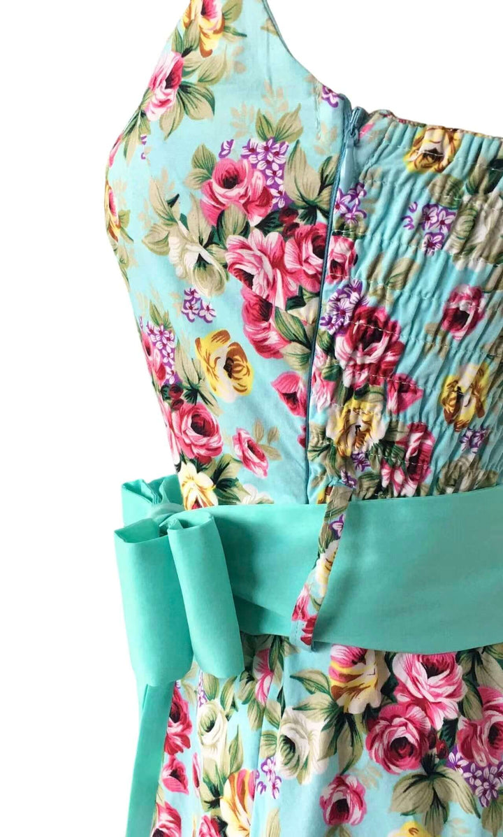 Aqua Floral Rockabilly Swing Dresses featuring a floral print and adjustable halter neckline.