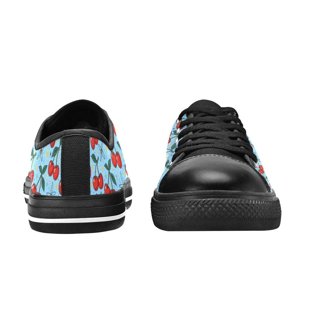 Atomic Cherries Kids Sneakers(B) featuring bright red cherries on a blue background with black accents and a sporty design.