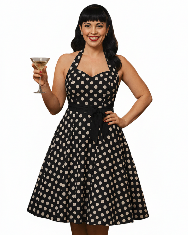 Black vintage-style women’s halter dress with white polka dots and full swing skirt
