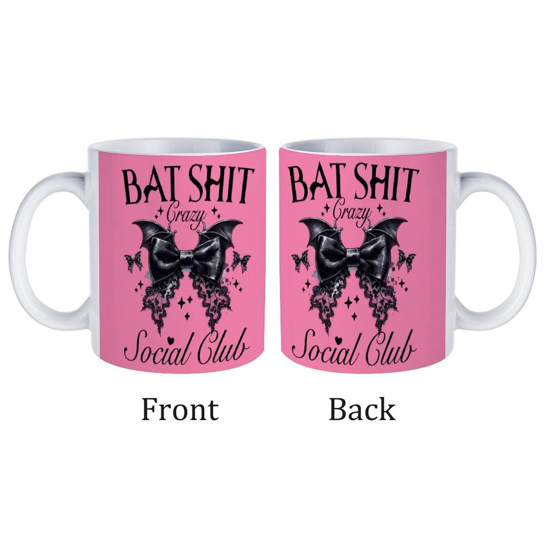 Bat Shit Crazy retro coffee mug with bat design, featuring pink background and text on both sides.