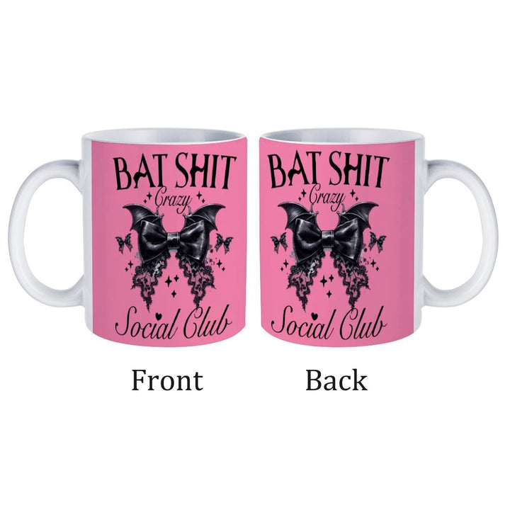 Bat Shit Crazy retro coffee mug with bat design, featuring pink background and text on both sides.