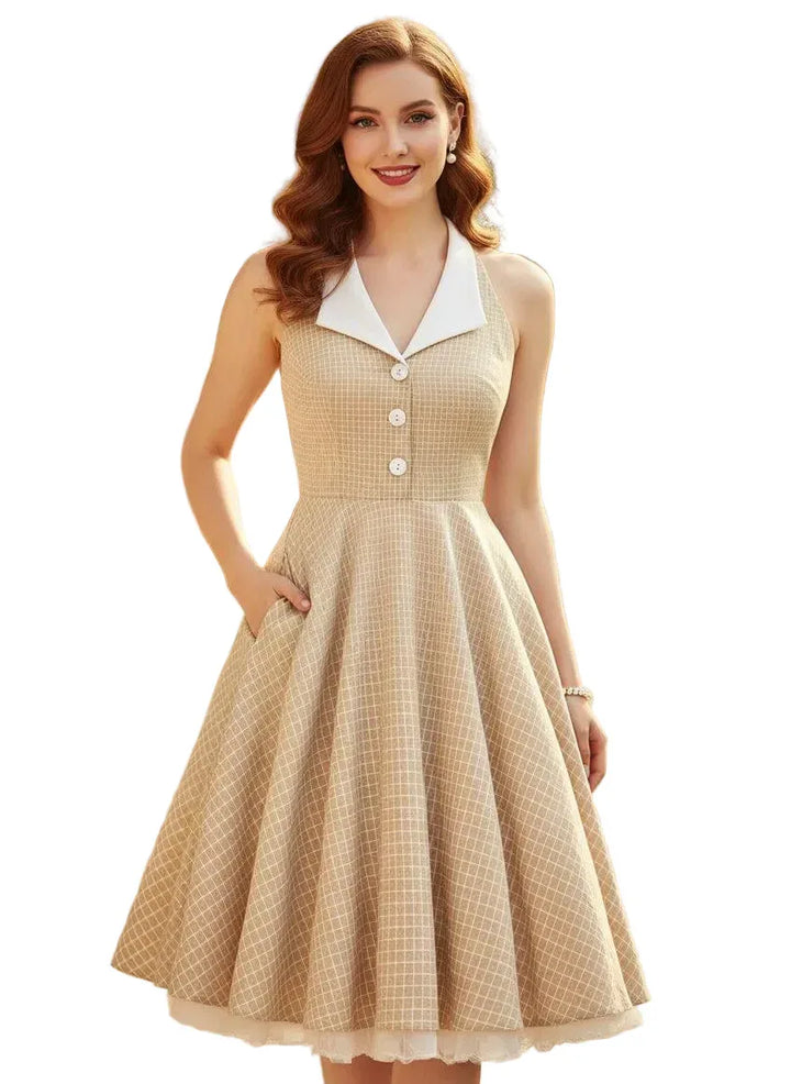 Beige vintage-style women’s halter dress with subtle check pattern, button front bodice and full swing skirt
