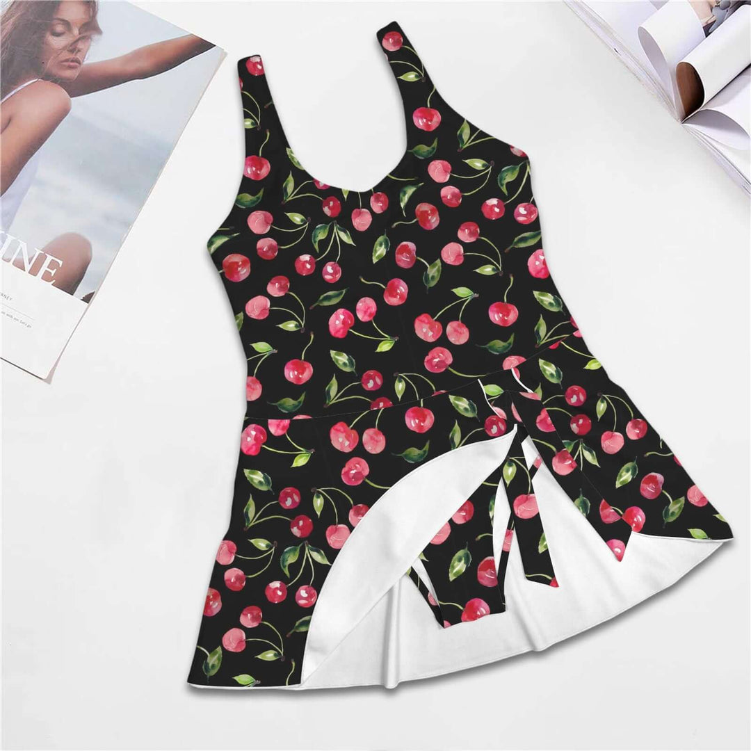 Black Cherries One Piece Skirted Swimsuit featuring a vintage cherry print and elegant skirted design.