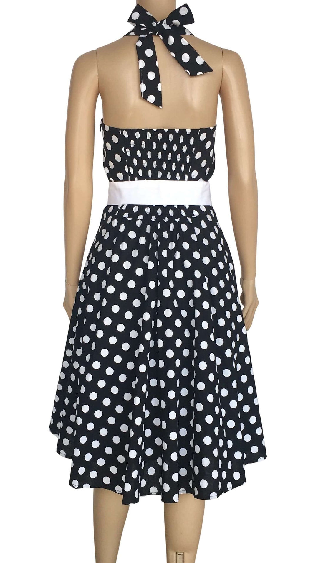 Back view of Black Polkadot Rockabilly Swing Dresses with halter neckline and white belt