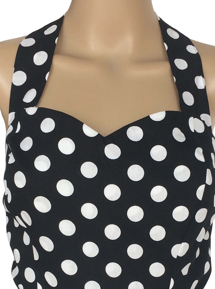 Black Polkadot Rockabilly Swing Dresses close-up of halter neckline with white polka dots on black fabric