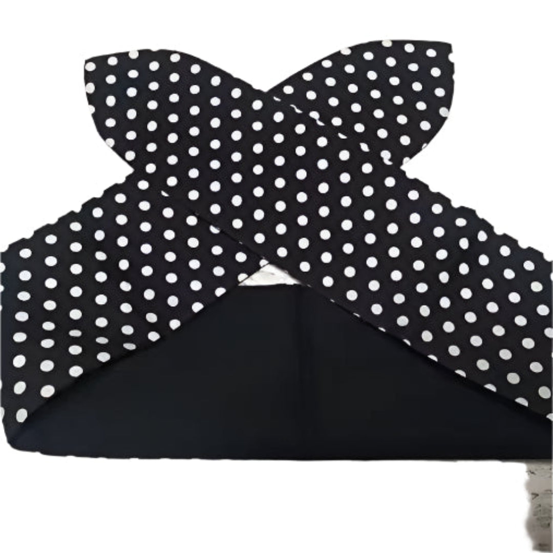Handmade black and white polka dot hair tie, perfect for vintage pin-up hairstyles and effortless styling.
