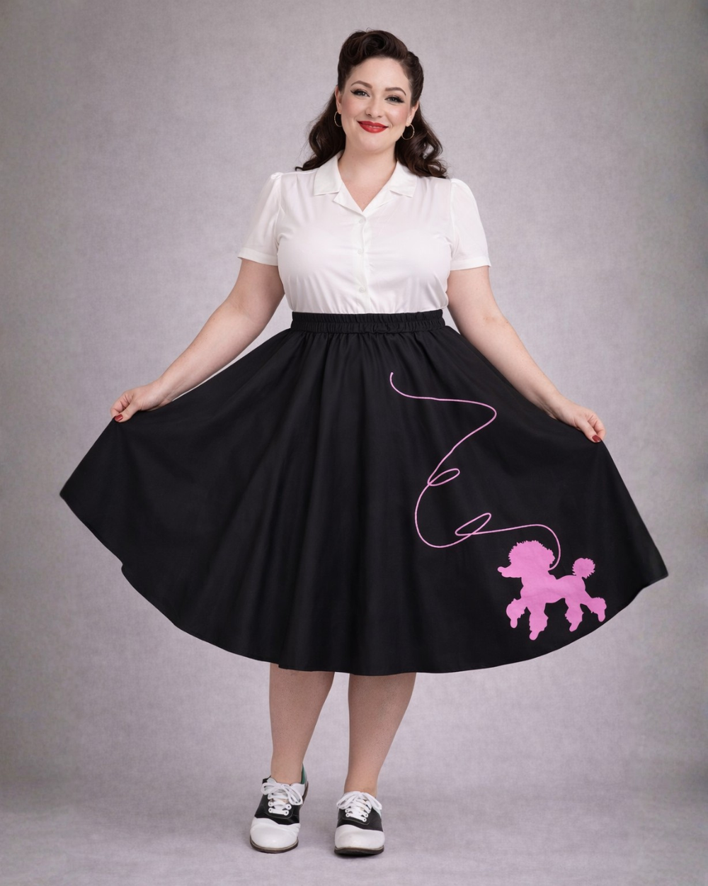 Black 1950s retro poodle skirt with pink poodle design worn by plus size vintage style model