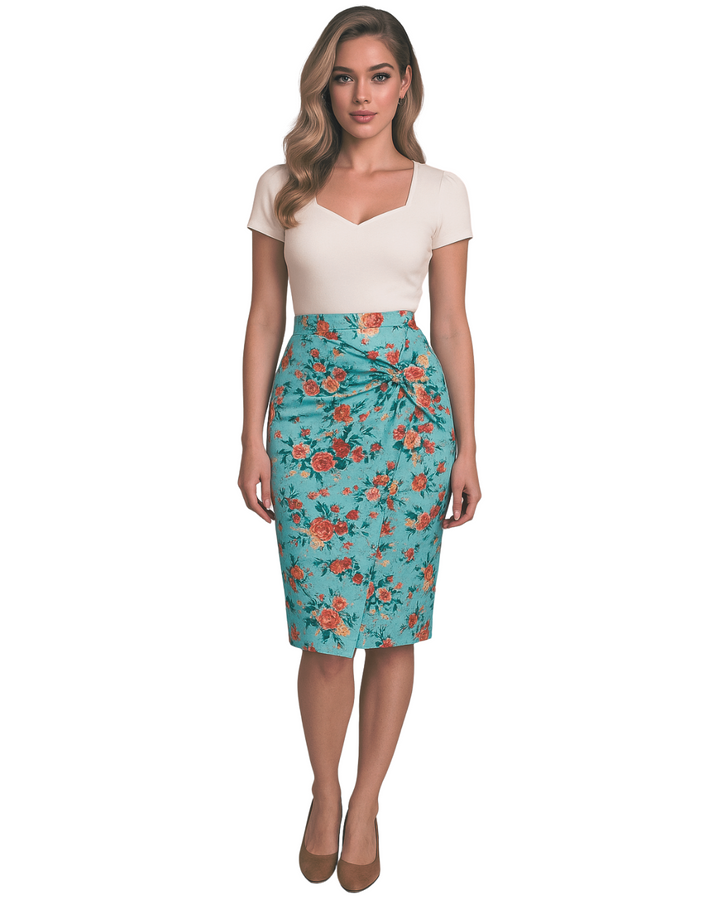 Woman wearing a white top and floral pencil skirt on a white background