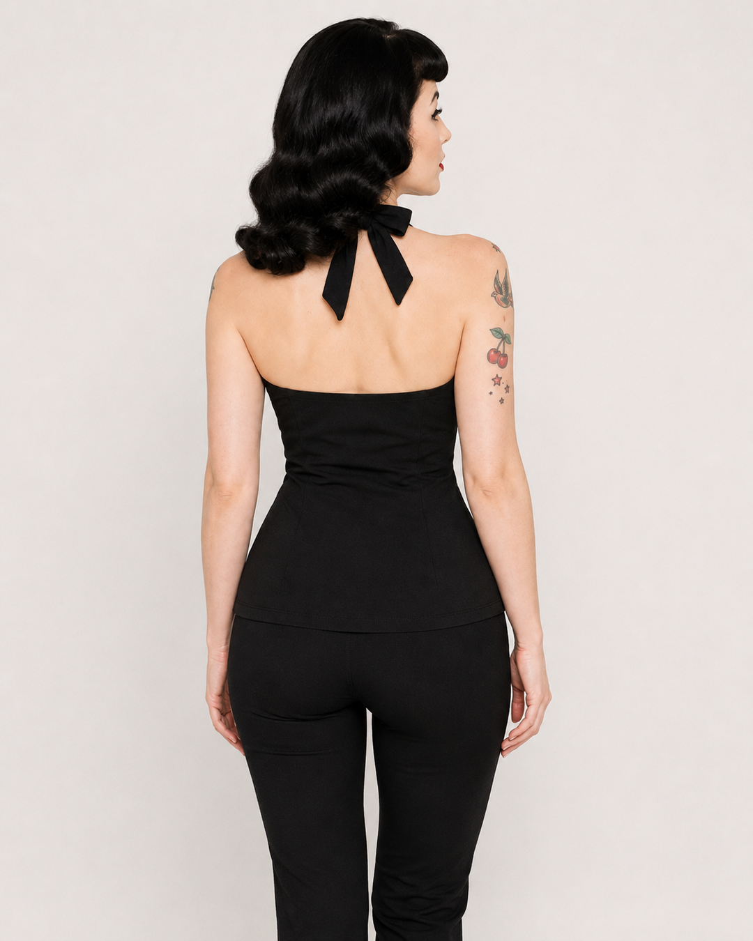 Liquorbrand black bow halter top back view showing halter neck tie bow