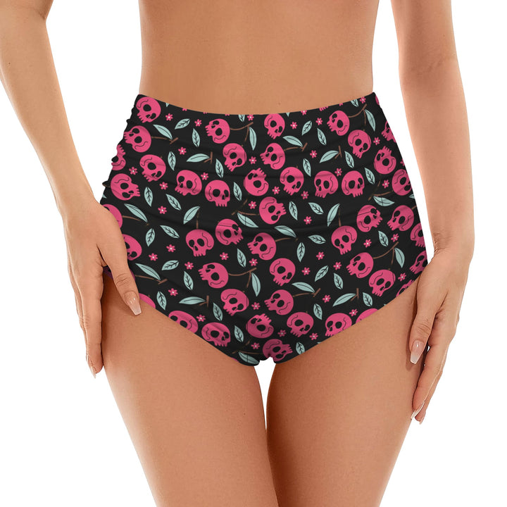 High waist bikini bottoms featuring a bold cherry skulls print on a black background, perfect for beach or pool wear.