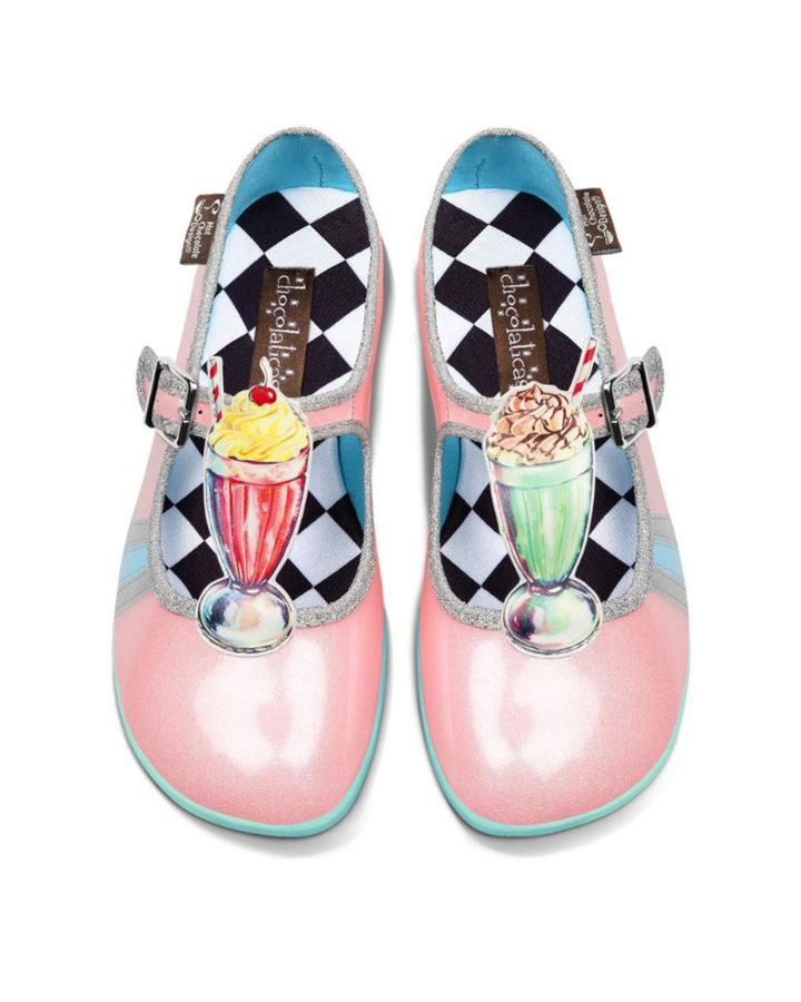 Pair of pink shoes with ice cream cone decorations on a white background