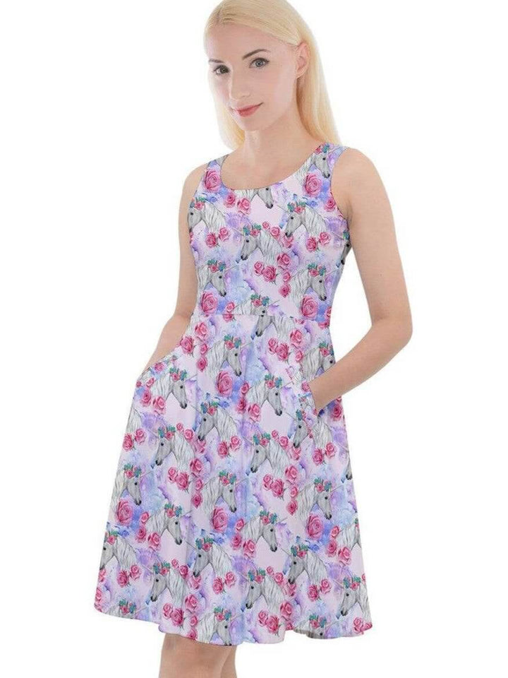 Fantasy unicorn knee-length skater dress with floral print, featuring pockets and a flattering fit on a model.