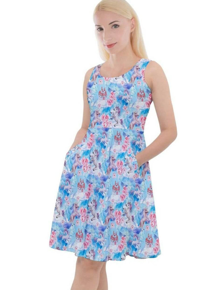 Model wearing a knee-length skater dress with a colorful unicorn print and pockets, showcasing a flattering fit and flare design.