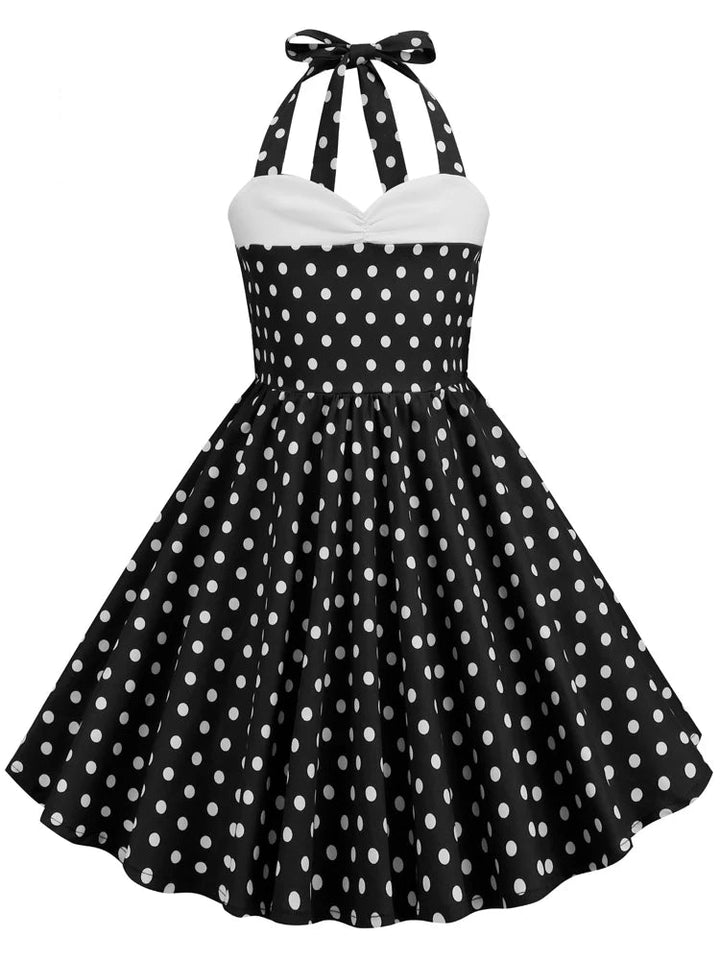 Girls Polka Dot Halter Rockabilly Dress in black and white, perfect for twirling and special occasions.