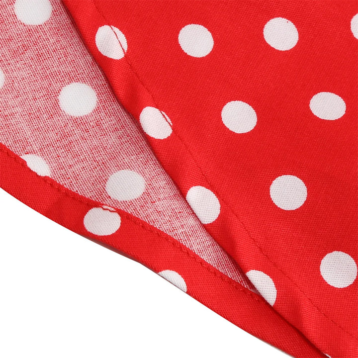 Close-up of red fabric with white polka dots, showcasing the playful print for a rockabilly dress.