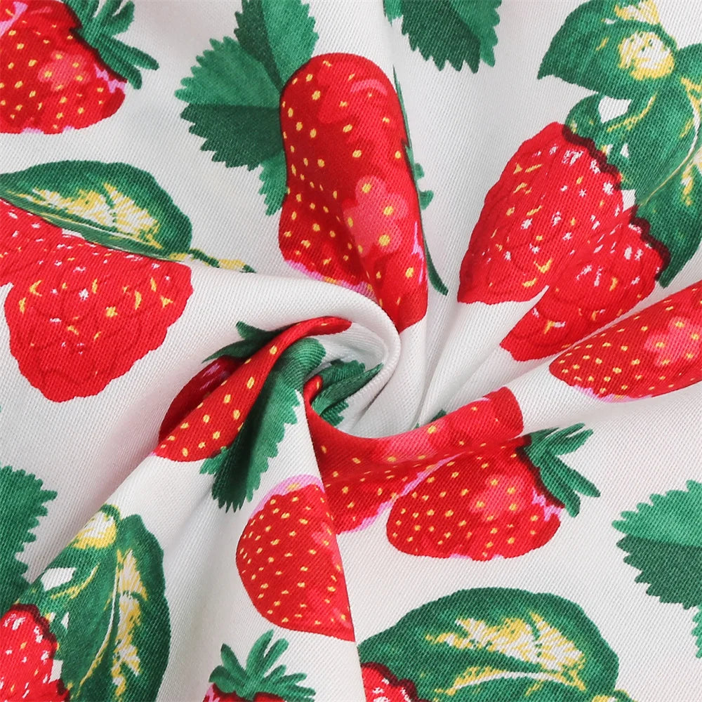 Close-up of playful strawberry print fabric perfect for a Girls Strawberry Halter Rockabilly Dress.