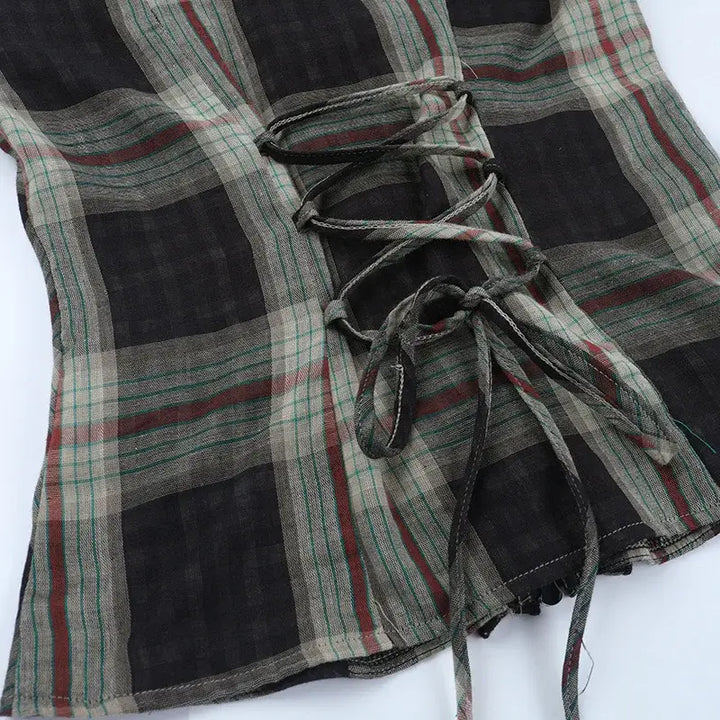 Gothic Plaid Ruffle Blouse showcasing the unique back corset-style lace-up detail and plaid pattern.