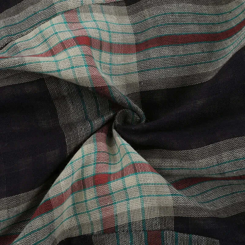 Gothic Plaid Ruffle Blouse fabric detail featuring a stylish plaid pattern with dark tones and contrasting stripes.
