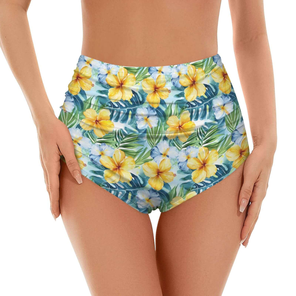 High waisted bikini bottoms featuring a vibrant tropical hibiscus print in yellow and blue, ideal for beachwear.
