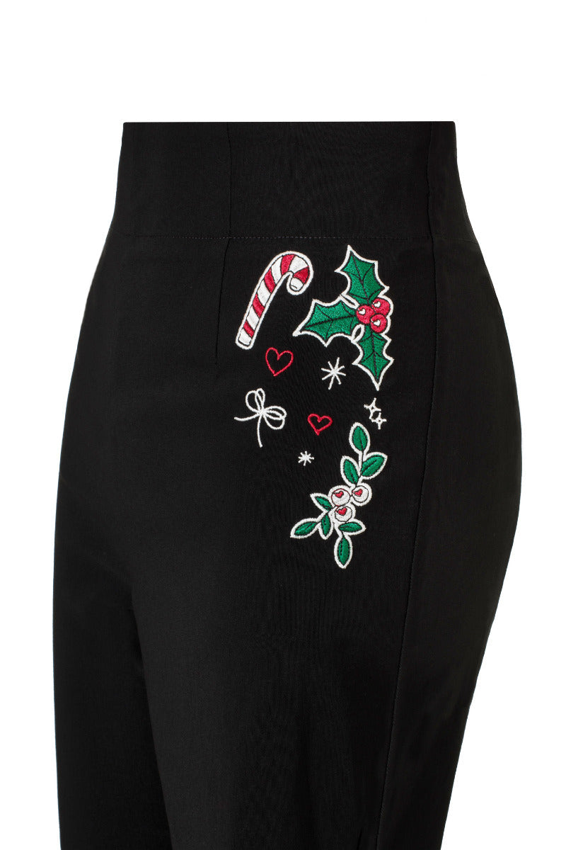 Detail view of the black bengaline fabric and tailoring on Hell Bunny Natalie capris