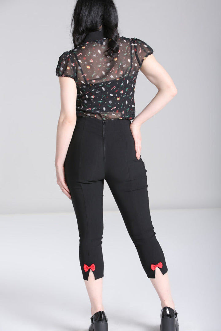 Back view of Hell Bunny Natalie black capris with removable red bows at the leg hems