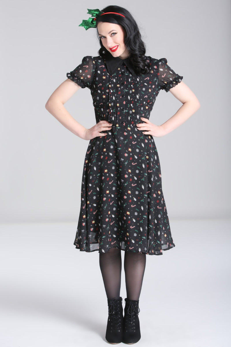 Front view of the Hell Bunny Natalie black Christmas chiffon midi dress on a model, showing the full fit-and-flare shape