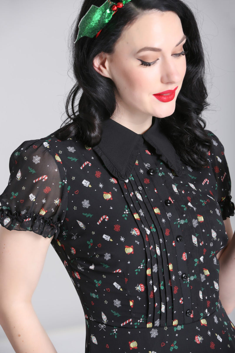 Close-up of the Hell Bunny Natalie black Christmas dress bodice, pointed collar, buttons and sheer puff sleeve