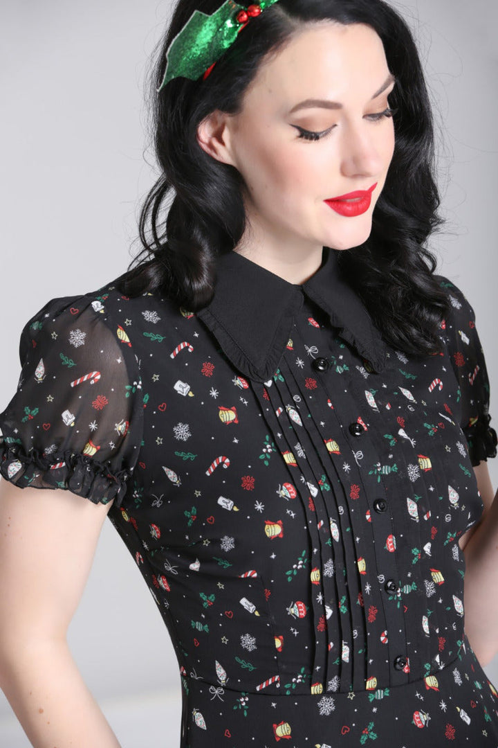 Close-up of the Hell Bunny Natalie black Christmas dress bodice, pointed collar, buttons and sheer puff sleeve