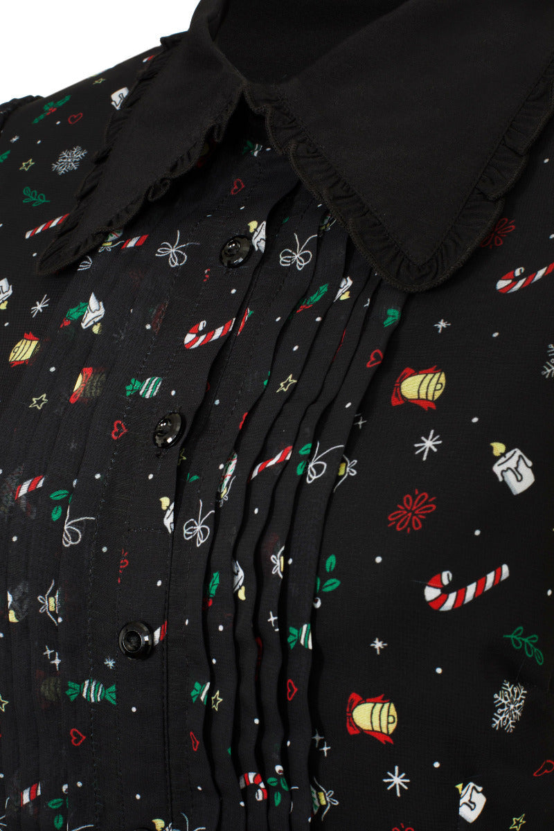 Close-up of the Natalie black chiffon Christmas print with candy canes, ornaments and snowflakes