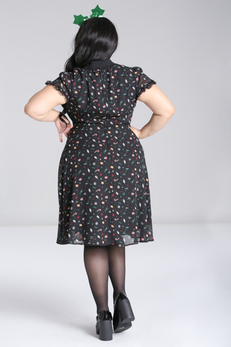 Back view of the Hell Bunny Natalie black festive chiffon dress on a plus-size model