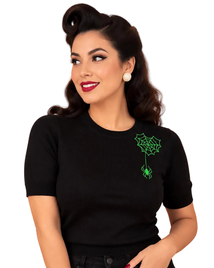 Hemet green spider embroidered black knit top styled with black jeans